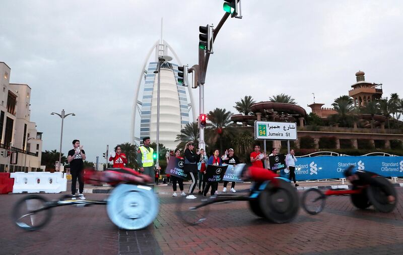 DUBAI, UNITED ARAB EMIRATES , Jan 24  – 2020 :- Athletes taking part in the wheelchair race during the Standard Chartered Dubai Marathon 2020 held on the Umm Suqeim Road in Dubai. ( Pawan  Singh / The National ) For News/Online/Instagram.