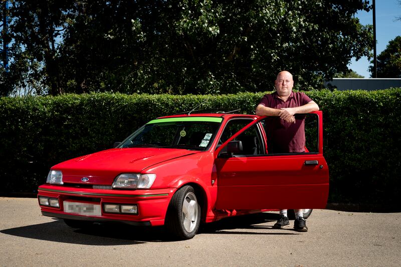 Laurence McGeough, 52, a vehicle 
technician in Greenford, West London, with his 1991 Ford Fiesta RS Turbo. "At the moment I drive this car every weekend to classic shows to meet similar owners. After August 29, I'm going to have to heavily clamp down and consider when I take it out'