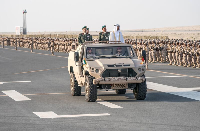 ZAYED MILITARY CITY, ABU DHABI, UNITED ARAB EMIRATES - November 28, 2017: HH Sheikh Mohamed bin Zayed Al Nahyan Crown Prince of Abu Dhabi Deputy Supreme Commander of the UAE Armed Forces (center R), inspects the cadets during a graduation ceremony for the 8th cohort of National Service recruits and the 6th cohort of National Service volunteers at Zayed Military City. Seen with HE Lt General Hamad Thani Al Romaithi, Chief of Staff UAE Armed Forces (center L) and Brigadier Faisal Mohamed Al Shehhi (C).

( Hamad Al Kaabi / Crown Prince Court - Abu Dhabi )
—