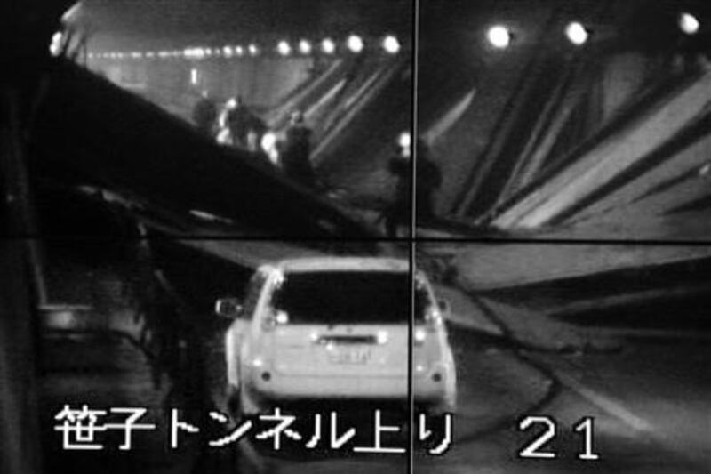 This image taken from the monitoring camera of Central Nippon Expressway's Hachioji branch, Tokyo, shows the fallen roof panels in the Sasago Tunnel, Yamanashi Prefecture, central Japan. AP Photo/Kyodo News.