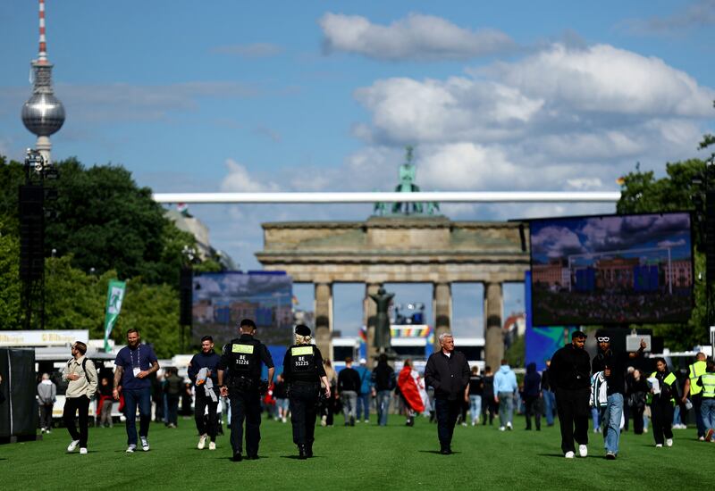 Police patrol the official Fan Mile on 17th June Street, close to the Brandenburg Gate, in Berlin. Reuters