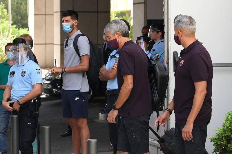 Quique Setien leaves the team hotel in Lisbon as players return home after their defeat to Bayern Munich in the Champions League quarter-finals. AFP