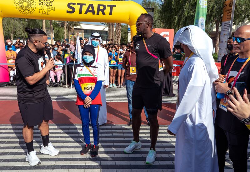 Usain Bolt with Emirati para athlete Hamda Hosani at Expo 2020 Dubai.