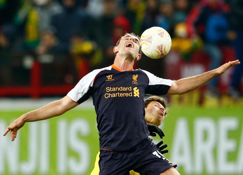 Anzhi Makhachkala's Fedor Smolov (R) fights for the ball with Liverpool's Jordan Henderson during their Europa League Group A soccer match at Lokomotiv stadium in Moscow November 8, 2012.  REUTERS/Grigory Dukor (RUSSIA  - Tags: SPORT SOCCER)