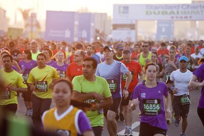 Thousands of runners take part in the Standard Chartered Dubai Marathon. Antonie Robertson / The National
