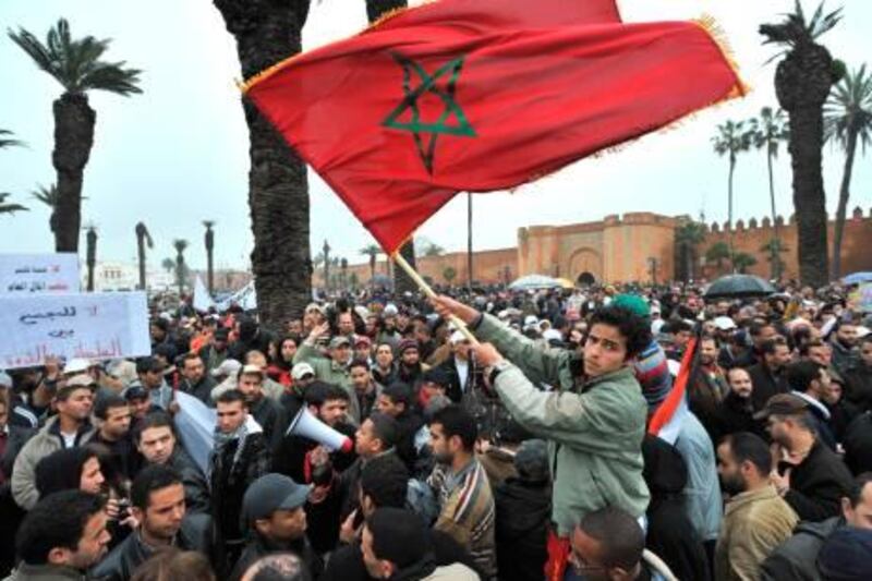 Moroccans demonstrate in Rabat on February 20, 2011 demanding political reform and limits on the powers of the king. Over 2,000 people took to the streets of the capital Rabat, 4,000 according to the organisers. Thousands of young Moroccans have joined the "February 20" movement on the social networking site Facebook, calling for peaceful demonstrations demanding a new constitution limiting the king's powers and more social justice.

AFP PHOTO/ABDELHAK SENNA

 *** Local Caption ***  336738-01-08.jpg