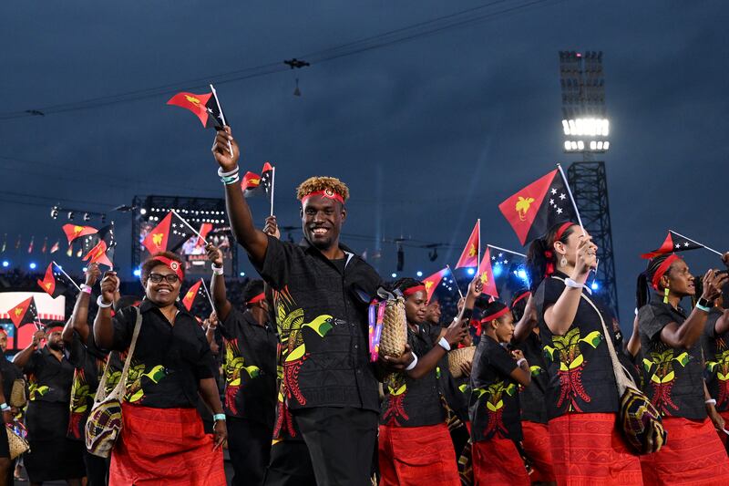 Members of Team Papua New Guinea enjoy the atmosphere. Getty Images