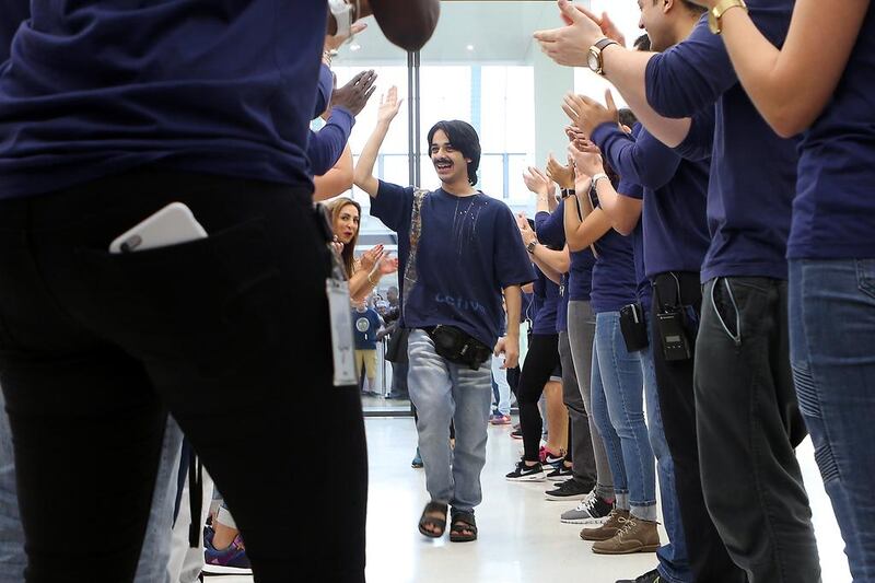 Ahmed Al Hajri was the first in line to <a href="http://www.thenational.ae/uae/technology/uae-residents-queue-through-the-night-for-iphone-7">receive the iPhone 7 </a>at the Apple store in Dubai’s Mall of the Emirates. Pawan Singh / The National