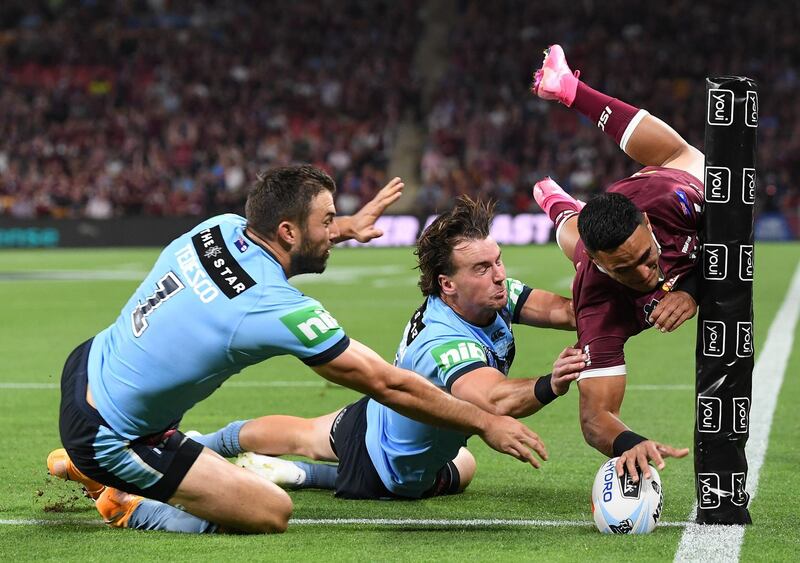 Queensland Maroons' Valentine Holmes scores against New South Wales Blues during Game 3 of the State of Origin series at Suncorp Stadium in Brisbane, on Wednesday, November 18. Getty