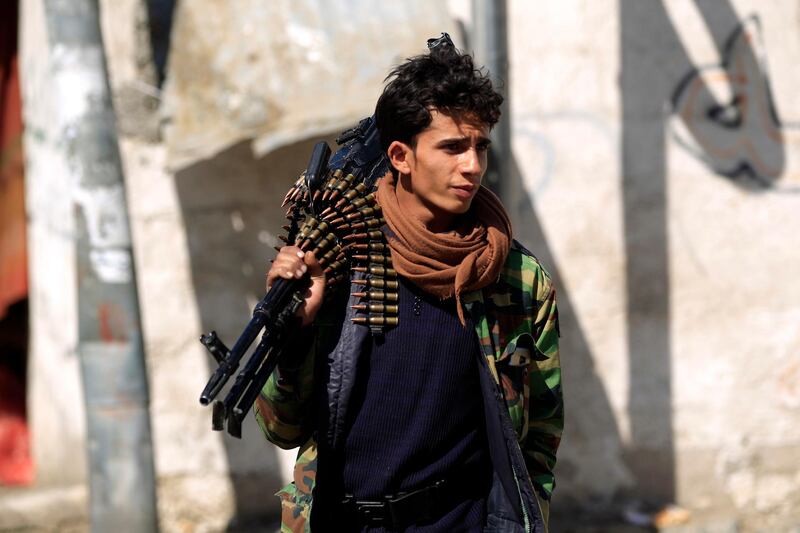 (FILES) In this file photo taken on November 09, 2019, a Shiite Huthi rebel fighter stands guard during a gathering to celebrate the birth of Islam's Prophet Mohammed in the Yemeni capital Sanaa. HealthvirusYemenSaudiUAEconflictUS The US on April 9, 2020, urged Yemen's Huthi rebels to reciprocate a ceasefire by Washington's ally Saudi Arabia, which said it would pause attacks due to the coronavirus pandemic. / AFP / MOHAMMED HUWAIS
