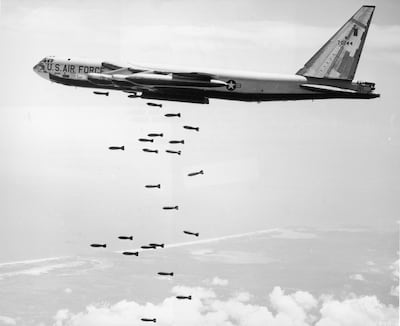 A US Air Force strategic air command B-52 Stratofortress drops a string of 750-pound bombs over a coastal target during the Vietnam War. US Air Force / Getty Images