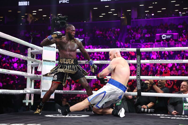Deontay Wilder sends Robert Helenius crashing to the canvas in the first round. Getty