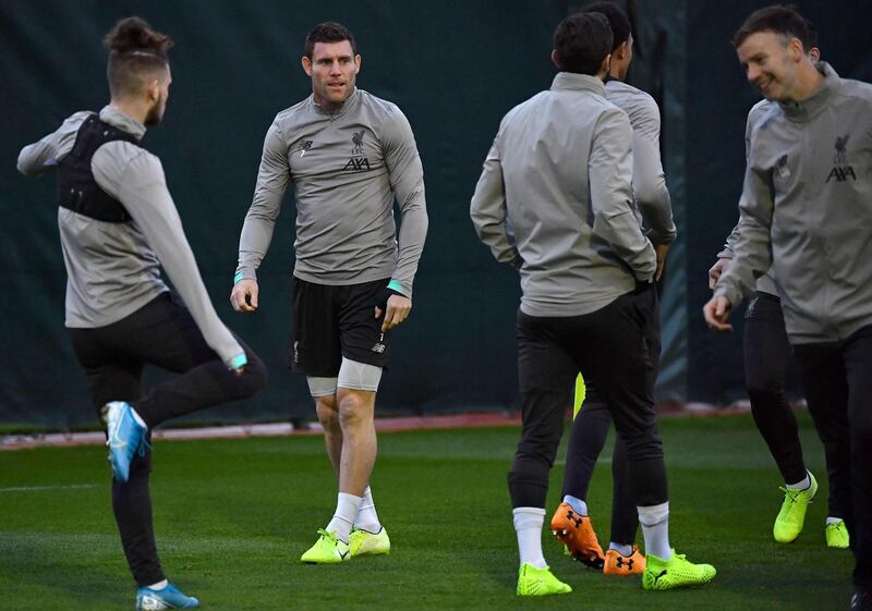 Midfielder James Milner, second left, at training in Liverpool. AFP