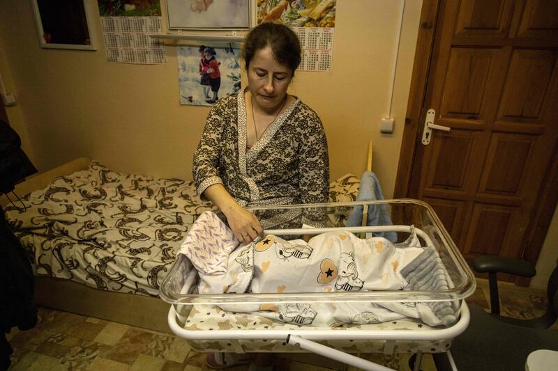 A mother tends to her newborn baby in the shelter of a maternity ward in the city of Zhytomyr, northern Ukraine. AFP