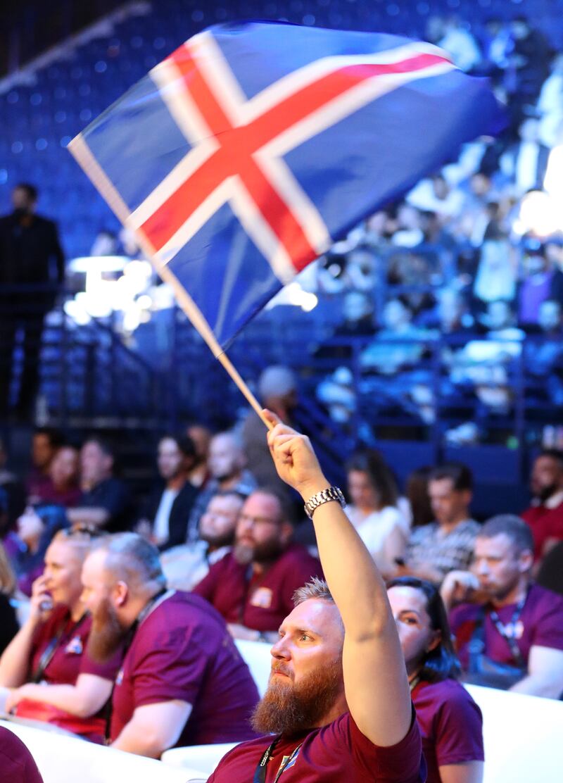 A Thor Björnsson supporter waves an Iceland flag.
