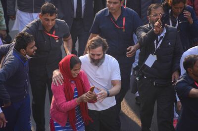 India's Congress party leader Rahul Gandhi, centre, walks in New Delhi, on December 24, during his continuing 150-day march.  AFP