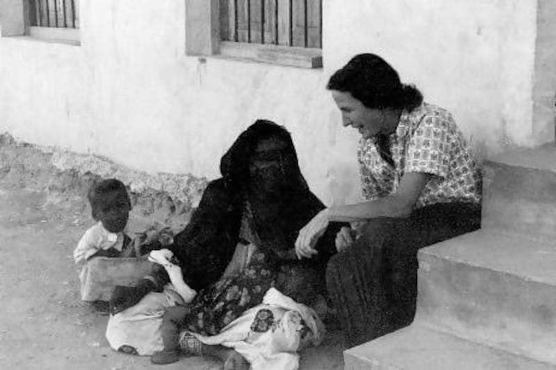 One of the two doctors at the opening of the Al Ain Oasis Hospital in 1960, Dr Marian Kenned speaks to a patient at the hospital’s first building, a mud block two-storey house donated by Sheikh Zayed. Courtesy Oasis Hospital