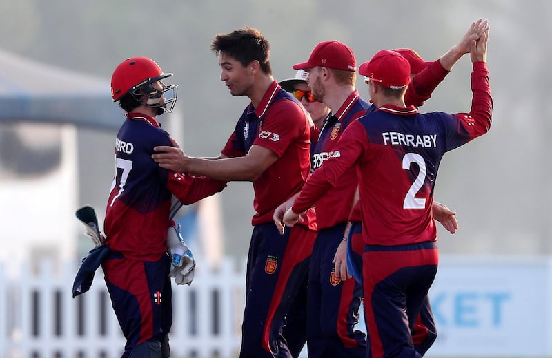 ABU DHABI , UNITED ARAB EMIRATES , October 22  – 2019 :- Ben Stevens (center) of Jersey celebrating after taking the wicket of Rameez Shahzad during the World Cup T20 Qualifiers between UAE vs Jersey held at Tolerance Oval cricket ground in Abu Dhabi.  ( Pawan Singh / The National )  For Sports. Story by Paul