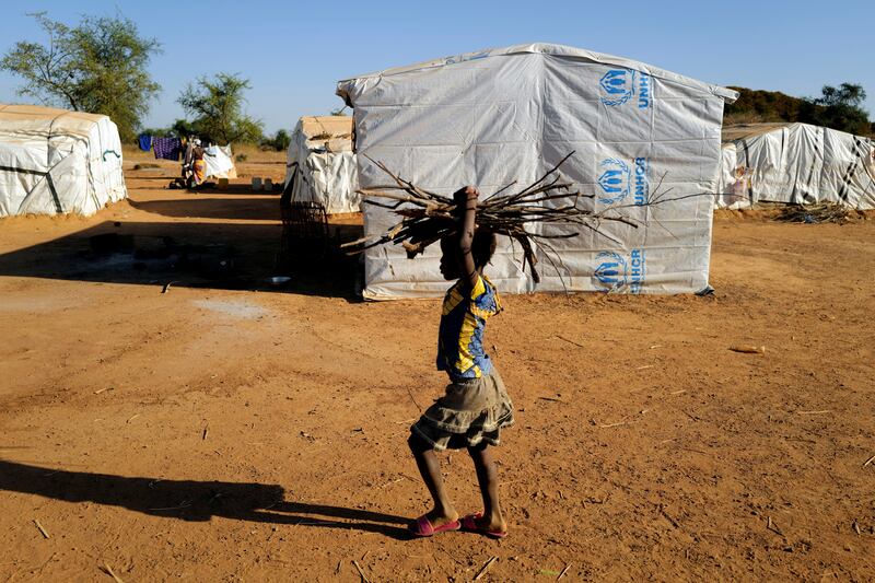A girl carries firewood at a camp for internally displaced people in Kaya, Burkina Faso - one of four Sahel countries expected to face extreme levels of food insecurity in coming months. Reuters