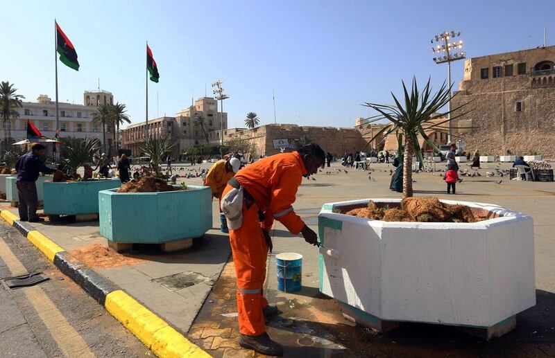 Libyan workers paint giant pots in Tripoli’s Martyrs’ Square on February 15, 2017 in preparation for celebrations marking the sixth anniversary of the start of the armed revolt that ousted longtime dictator Muammar Qaddafi with the country still mired in chaos and insecurity. Mahmud Turkia/AFP