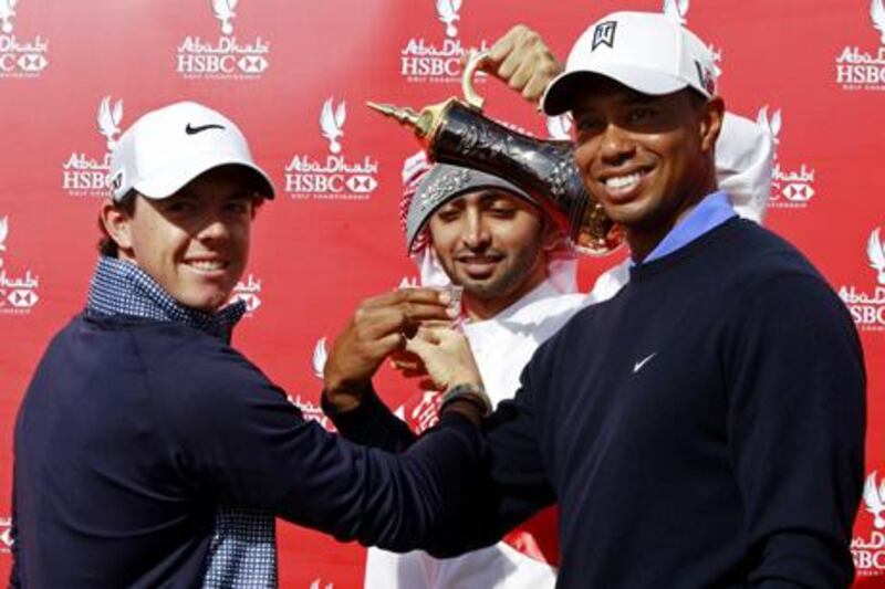 Roy McIlroy and Tiger Woods make a toast ahead of the Abu Dhabi HSBC Golf Championship.