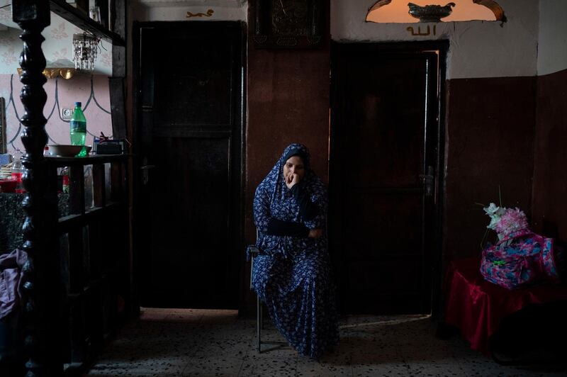 Amani al-Bilbisi, sits outside her son Mohammed Khader's room as he lays in bed in Gaza City. Mohammed was shot in the leg at one of the demonstrations on Gaza strip's border with Israel. Ever since Hamas launched demonstrations in March against Israel's blockade of Gaza, children have been a constant presence in the crowds. Since then, U.N. figures show that 948 children under 18 have been shot by Israeli forces and 2,295 have been hospitalized, including 17 who have had a limb amputated. AP