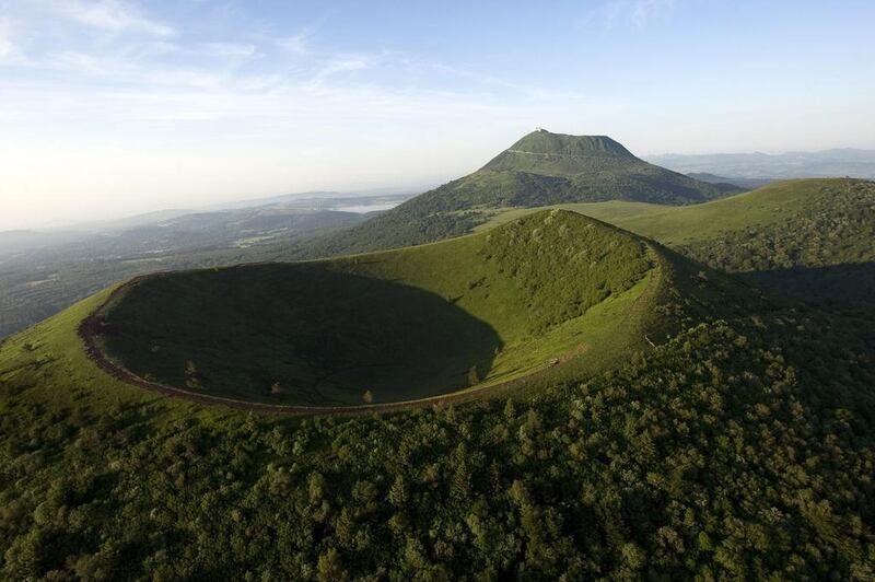 The Chaine des Puys, a volcanic chain of 80 volcanoes over a distance of 32 km, with the Puy de Dome (top) and the Puy de Pariou (bottom) near Clermont-Ferrand in France will be considered as a Unesco World Heritage site at the committee meets in Doha. Thierry Zoccolan/AFP Photo