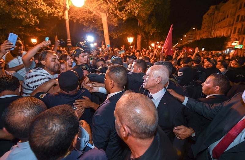 Tunisian President Kais Saied (2-R) celebrating with his supporters the almost certain victory of the 'yes' vote in a referendum on a new constitution, after the projected outcome was announced in Tunis. EPA