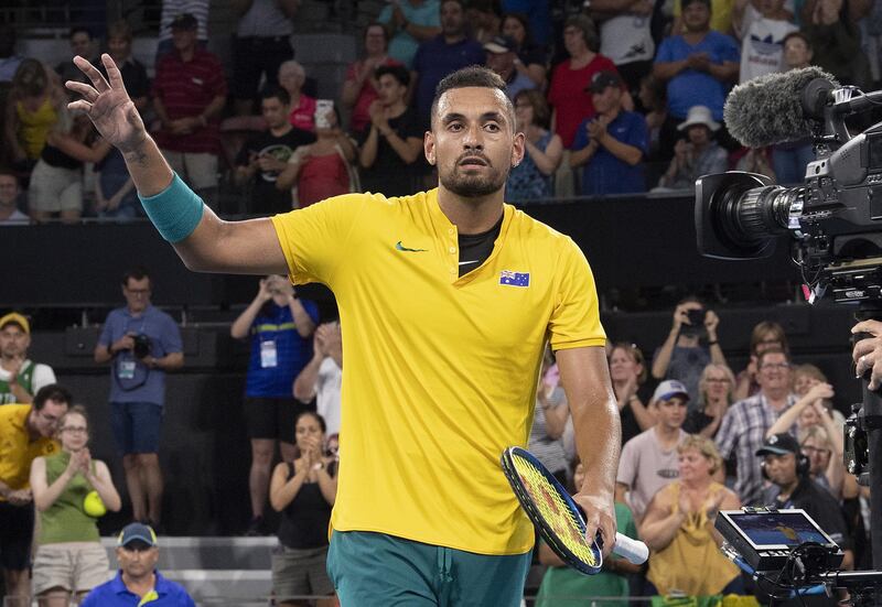 epa08110272 Nick Kyrgios of Australia celebrates after winning  his singles match against Stefanos Tsitsipas of Greece on day 5 of the ATP Cup tennis tournament at Pat Rafter Arena in Brisbane, Australia, 07 January 2020.  EPA/DAVE HUNT AUSTRALIA AND NEW ZEALAND OUT  EDITORIAL USE ONLY  EDITORIAL USE ONLY