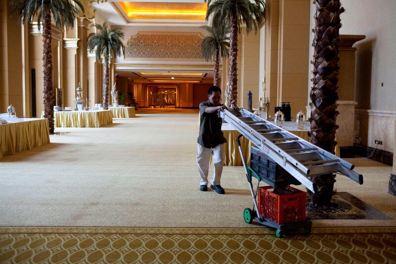 Abu Dhabi, United Arab Emirates, July 15, 2013:     Men work on the auditorium at Emirates Palace in Abu Dhabi on July 15, 2013. Christopher Pike / The National

Reporter: GILLIAN DUNCAN *** Local Caption ***  CP0715-emirates palace009.JPG