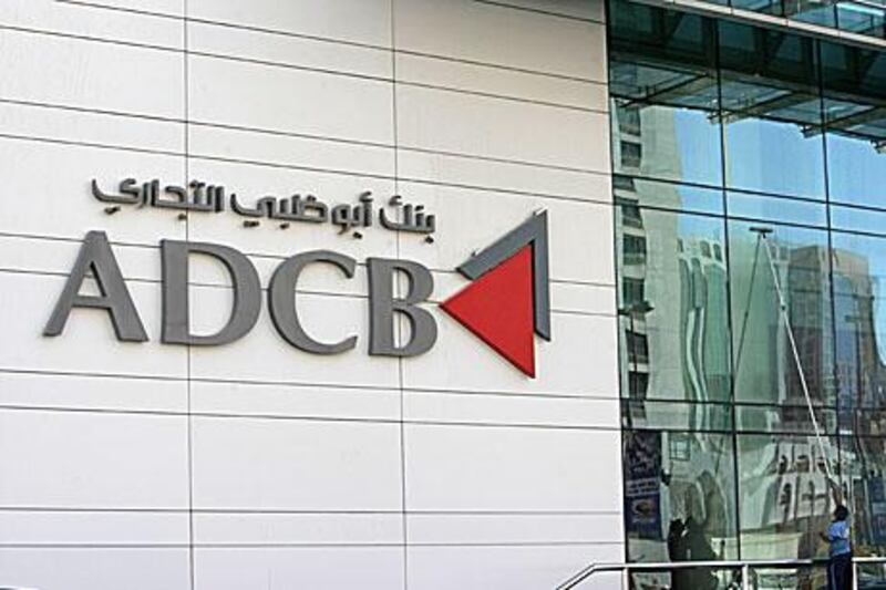 Abu Dhabi Commercial Bank yesterday announced it was suing Credit Suisse and Standard and Poor’s.