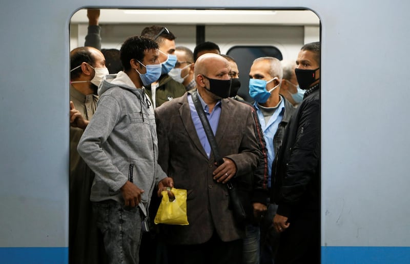 Men are seen inside the underground Al Shohadaa "Martyrs" metro in Cairo, Egypt. Reuters