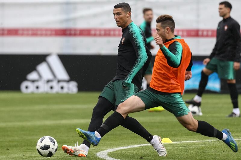 Cristiano Ronaldo and Raphael Guerreiro take part in a training session for Portugal. Paulo Novais / EPA
