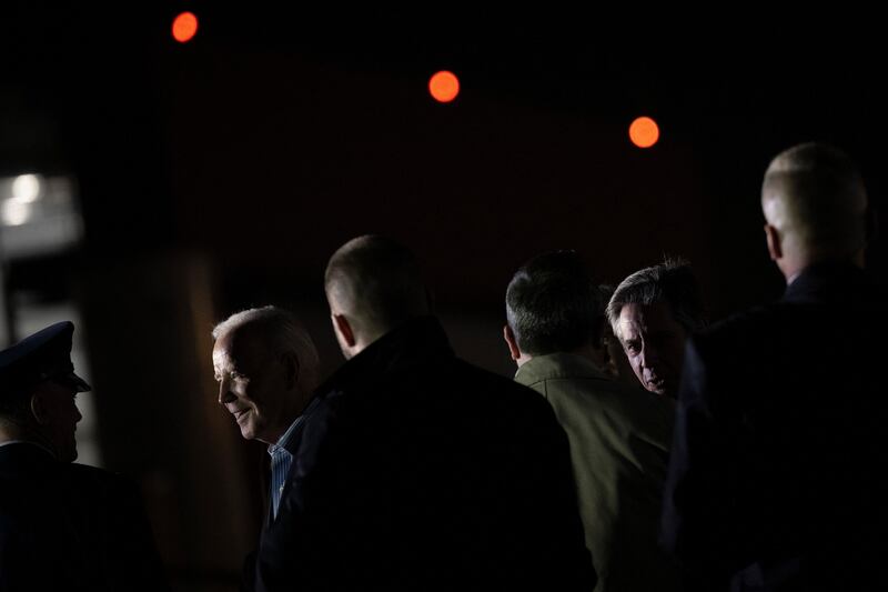 US Secretary of State Antony Blinken, right, follows Mr Biden, left, at the airport.  AFP