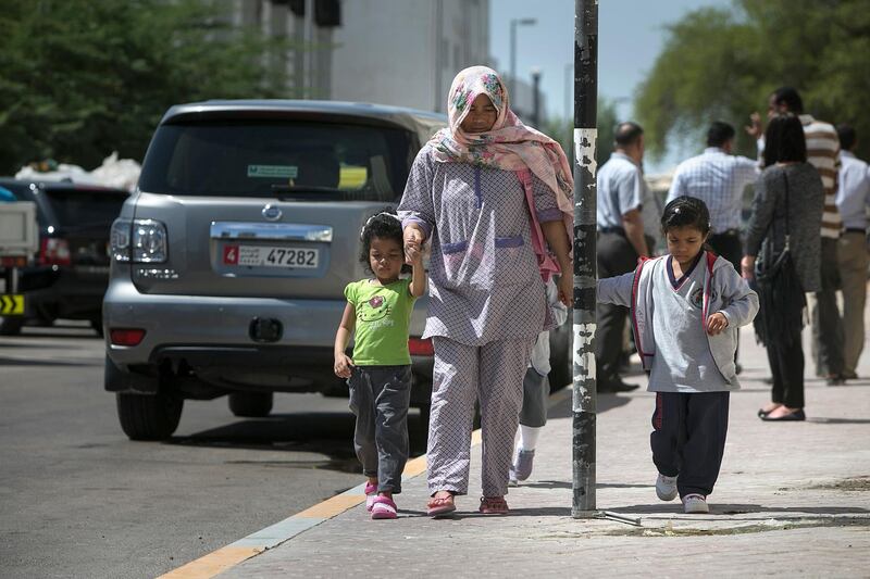 ABU DHABI, UNITED ARAB EMIRATES, Oct. 8, 2014:  
Children walk home after school at the Al Worood Academy Private School on Wedneday, Oct.8, 2014. Police are investigating the death of 3-year-old Nizaha Aalaa, a KG-1 pupil and a first-month student at the Al Worood Academy Private School, who was found dead on a school bus shortly after noon the previous day, on Tuesday, Oct. 7, 2014, apparently left there since the morning. (Silvia Razgova / The National)

Usage: Oct. 8, 2014
Section: NA
Reporter:  Lindsay Carroll

