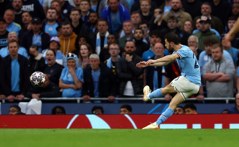 Manchester City's Bernardo Silva scores their first goal. Reuters