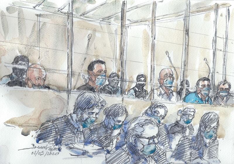 This court sketch made at the Paris courthouse shows the fourteen accused and their lawyers at the opening of the trial.  AFP