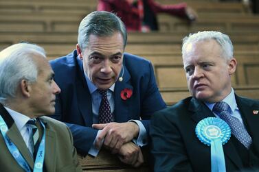 Brexit Party leader Nigel Farage speaks with parliamentary candidates at a rally in central London, 4 November 2019. EPA