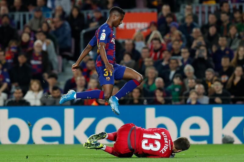 Levante Aitor Fernandez saves the ball as Ansu Fati jumps over him. AP