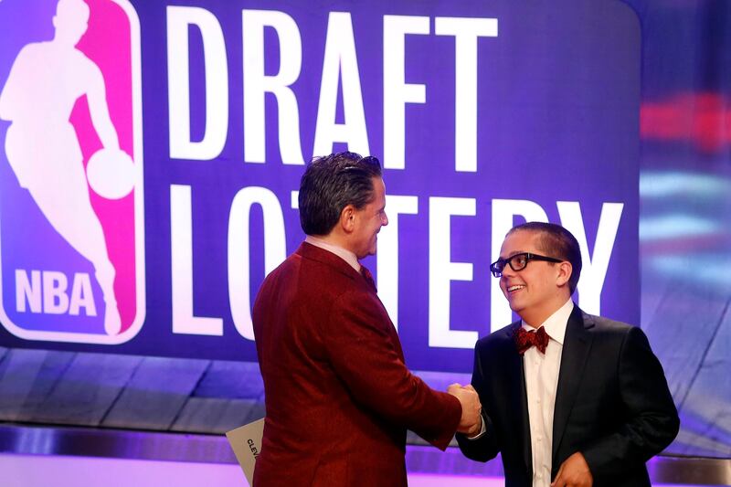 Cleveland Cavaliers owner Dan Gilbert congratulates his son Nick Gilbert after the team won the NBA basketball draft lottery, Tuesday, May 21, 2013 in New York. (AP Photo/Jason DeCrow) *** Local Caption ***  NBA Draft Lottery Basketball.JPEG-01f4a.jpg