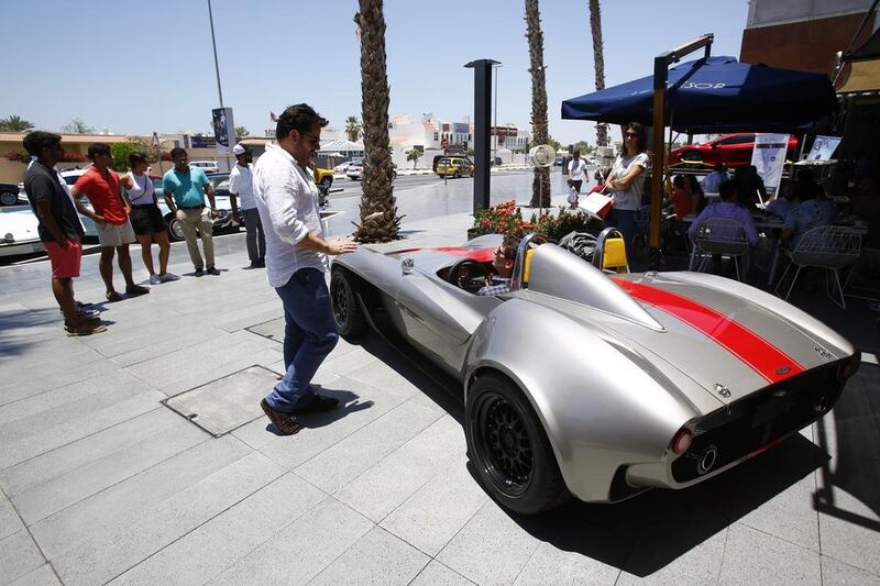 Onlookers take in the classic lines of the Jannarelly in Dubai. Courtesy Jannarelly Automotive