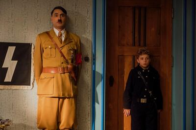 This image released by Fox Searchlight Pictures shows Taika Waititi, left, and Roman Griffin Davis in a scene from "Jojo Rabbit."  On Monday, Jan. 13, the film was nominated for an Oscar for best picture. (Fox Searchlight Pictures via AP)