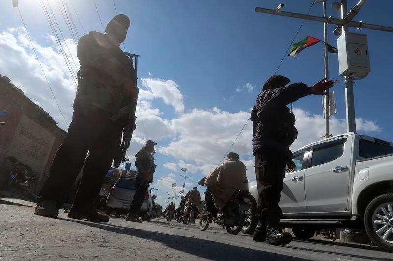 Pakistani security officials check people at a roadside checkpoint in Quetta, the provincial capital of Balochistan province, Pakistan, on Wednesday. EPA