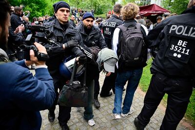 Police in Berlin remove a pro-Palestinian activist from a protest at the city's Free University campus. AFP 