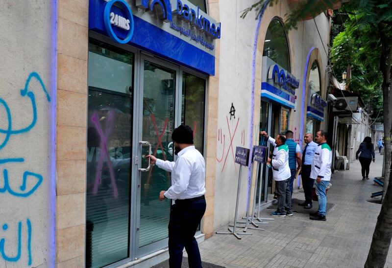 A Lebanese man enters a bank in Beirut on November 1, 2019.  AFP