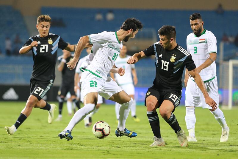 Iraqi player Rebin Ghareeb Solaka (C) in action with Argentine player Simeone Giovanni (R)   during the international friendly soccer match between Argentina and Iraq, in Riyadh, Saudi Arabia. EPA