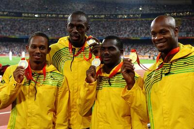 Usain Bolt, second left, alongside Jamaica teammates Michael Frater, left, Nesta Carter and Asafa Powell, right, after winning gold medals in Beijing. Getty Images