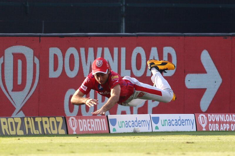 Ravi Bishnoi of Kings XI Punjab dives to stop the four during match 53 of season 13 of the Dream 11 Indian Premier League (IPL) between the Chennai Super Kings and the Kings XI Punjab at the Sheikh Zayed Stadium, Abu Dhabi  in the United Arab Emirates on the 1st November 2020.  Photo by: Vipin Pawar  / Sportzpics for BCCI