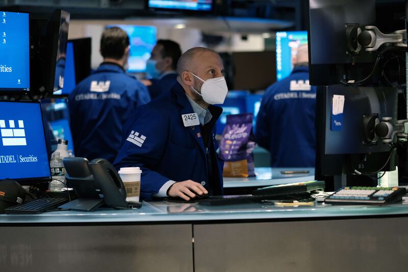 Traders work on the floor of the New York Stock Exchange in New York City. AFP