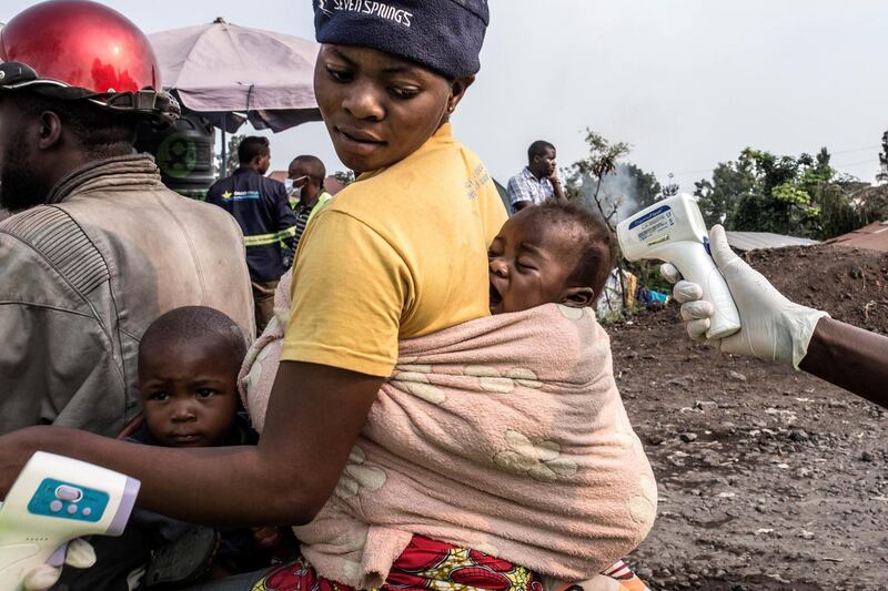 epa07751247 (FILE) - Health authorities checks a baby's temperature at a health checkpoint in Goma, RD Congo, on 05 July 2019 (issued on 01 August 2019). Rwanda's authorities decided on 01 August 2019 to close its borders with DR Congo temporary amid the detection of several ebola cases in Goma, close to Rwanda. A total of 1,813 people died in northeastern of the country in the first year after the Congolese Government officially stated that an ebola outbreak was hitting the country.  EPA/PATRICIA MARTINEZ